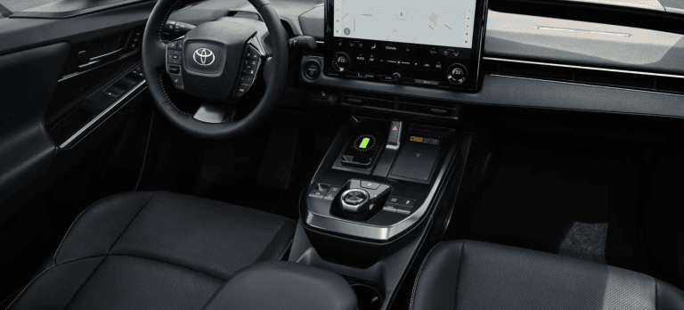 inside of 2026 Toyota bZ, shows steering wheel and touchscreen display